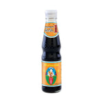 Deksomboon Black Soy Sauce D 400g bottle in a dry grocery setting, showcasing the dark soy sauce brand Deksomboon.