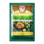 Look-Ped Green Curry Paste in a jar, vibrant green color, used for cooking flavorful Thai green curry dishes.