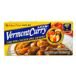 House Vermont Curry Hot grocery block of House Vermont Curry Hot with rich curry sauce and vegetables in a bowl.