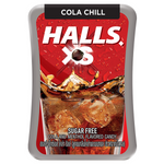 Halls XS Cola confectionery snacks featuring small, cola-flavored candies with branding packaging visible.