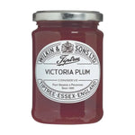 Tiptree Victoria Plum Preserve jar with a label, showing the 340g size, on a reflective surface.
