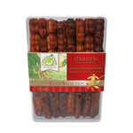 Seedless tamarind candies from Tamarind House, gold selection, in a clear package, showcasing glossy, golden-brown tamarind snack pieces.