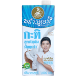 Coconut milk in a Praohom grocery brand carton, creamy white liquid in a kitchen setting