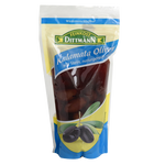 Bowl of Feinkost Dittmann Kalamata olives in brine, showcasing dark purple olives with a shiny, smooth texture.
