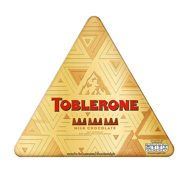 Toblerone chocolate milk festive tin with 152g of Toblerone chocolate bars and holiday-themed packaging.