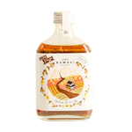Bottle of Komori Salad Dressing Shoyu, a healthy soy sauce for salads and Asian dishes, with a label showing the product name.