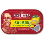Canned King Oscar salmon in olive oil with lemon slices, ready to serve, displayed in a clear glass bowl on a white background.