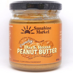 Sunshine Crunchy Dark Peanut Butter jar showing the label and lid, ideal for spreading or adding to recipes.