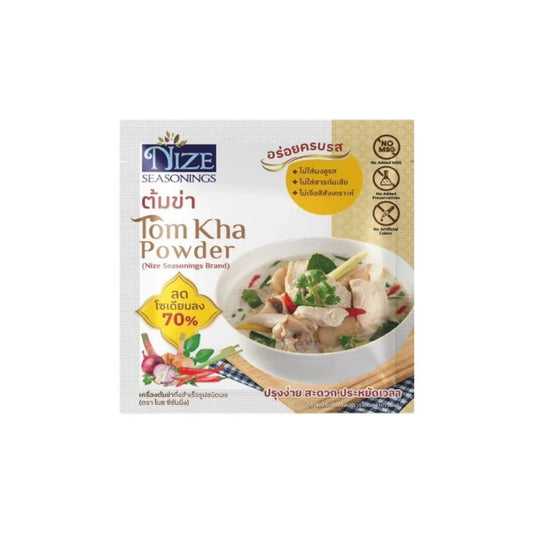 NIZE Clean Seasoning Powder Tom Kha flavor in a jar, with a spoon and fresh herbs on a wooden surface, ready for cooking.