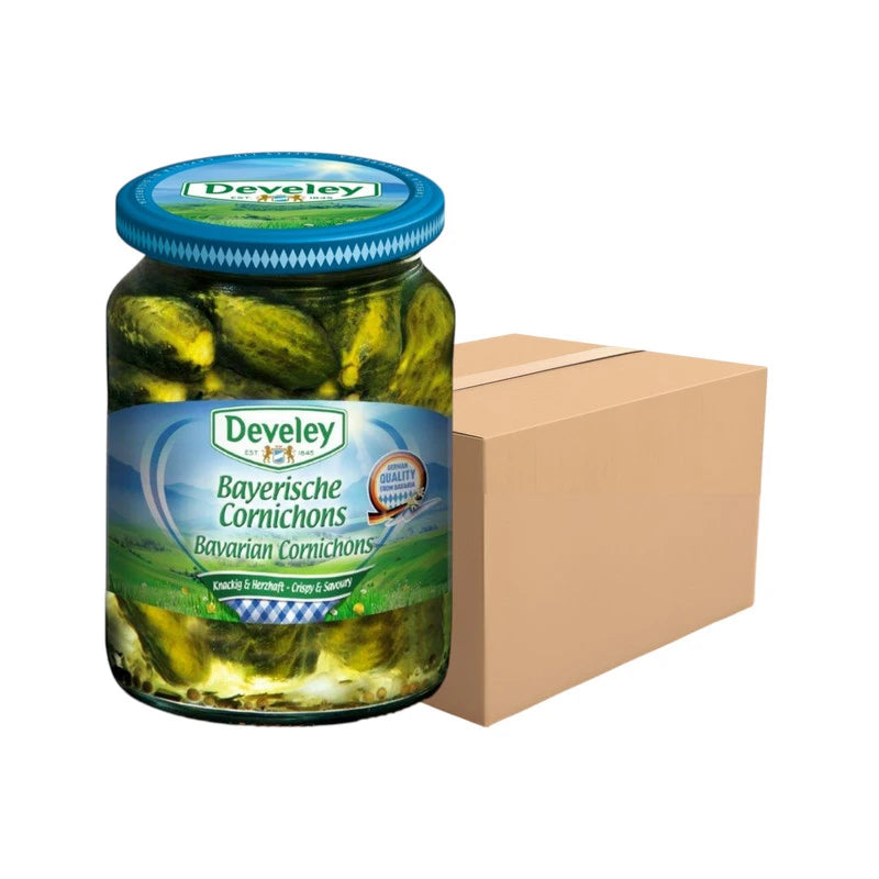 DEVELEY Bavarian Cornichons pickled gherkins in glass bottles, 330g each, arranged in a pack of 12 on a neutral background.