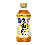 Bottle of Kikkoman Tsuyu Sirodashi soy-based Japanese cooking sauce on a grocery store shelf.