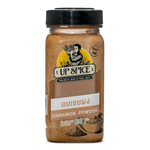 United Spice cinnamon powder in a clear jar, close-up of the brown ground cinnamon, used for baking and cooking in groceries.