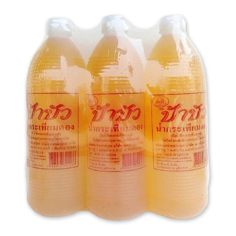 PA BUA Pickled Garlic Juice in a 950 mL bottle, shown in a case of three, with clear label and transparent liquid inside.
