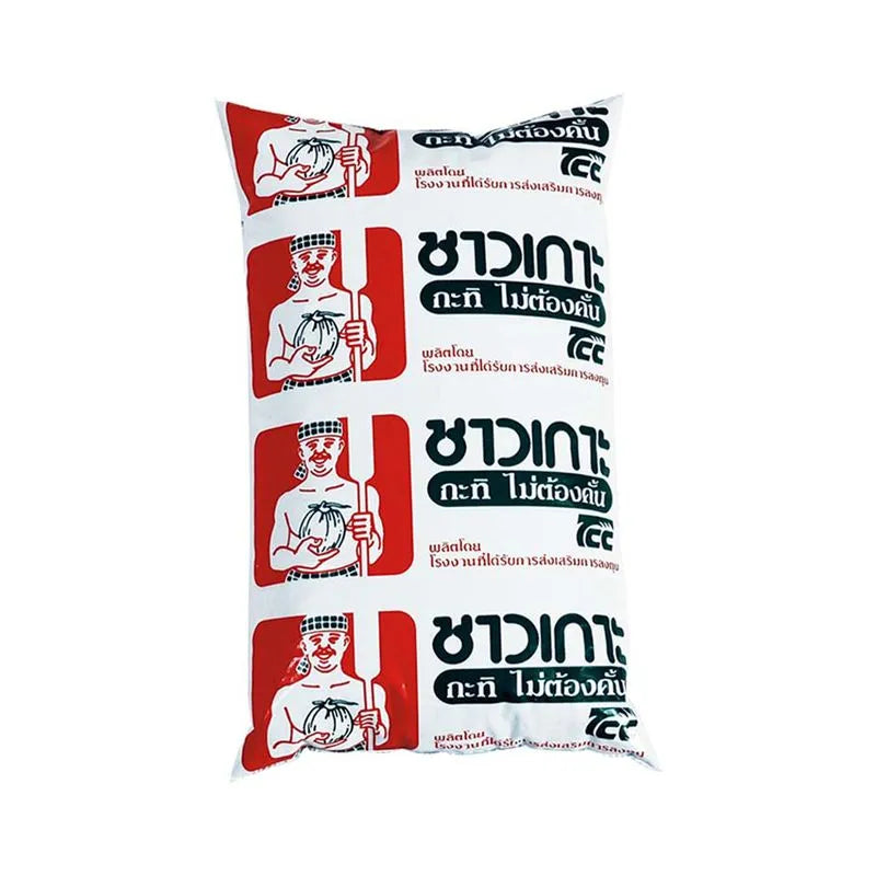 Coconut milk in a 1-liter carton from CHAOKOH, creamy white liquid with a smooth surface, suitable for cooking and beverages.
