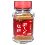 Ucc Shokunin Rich Flavor instant coffee drink in a glass, showcasing its rich, dark coffee color and smooth texture.