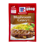 Jar of McCormick Mushroom Gravy in a grocery setting, showing the label and product packaging.