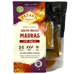 Patak's South Indian Madras curry kit with spice packets and recipe card, ideal for making authentic Indian curry at home.