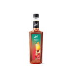 LIN Peach Syrup in a clear bottle, dry grocery product, sweet peach flavor for beverages and desserts.