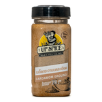 Ground United Cardamom spice in a container, used in cooking and baking, with a focus on the spice's fresh, aromatic appearance.