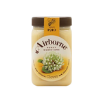 Airborne Clover Honey Cream in a jar, showcasing smooth honey spread with a golden color and creamy texture.