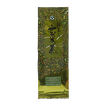 Bottle of Japanese green tea drink with green tea leaves and Japanese branding on the label, served in a clear glass.
