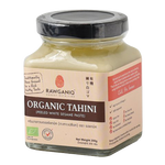 Rawganiq Organic White Tahini Peeled in a jar, showcasing smooth, creamy white sesame paste for healthy cooking and snacks.