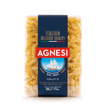 Agnesi Fusilli macaroni pasta in a grocery setting, showcasing the corkscrew-shaped pasta package.