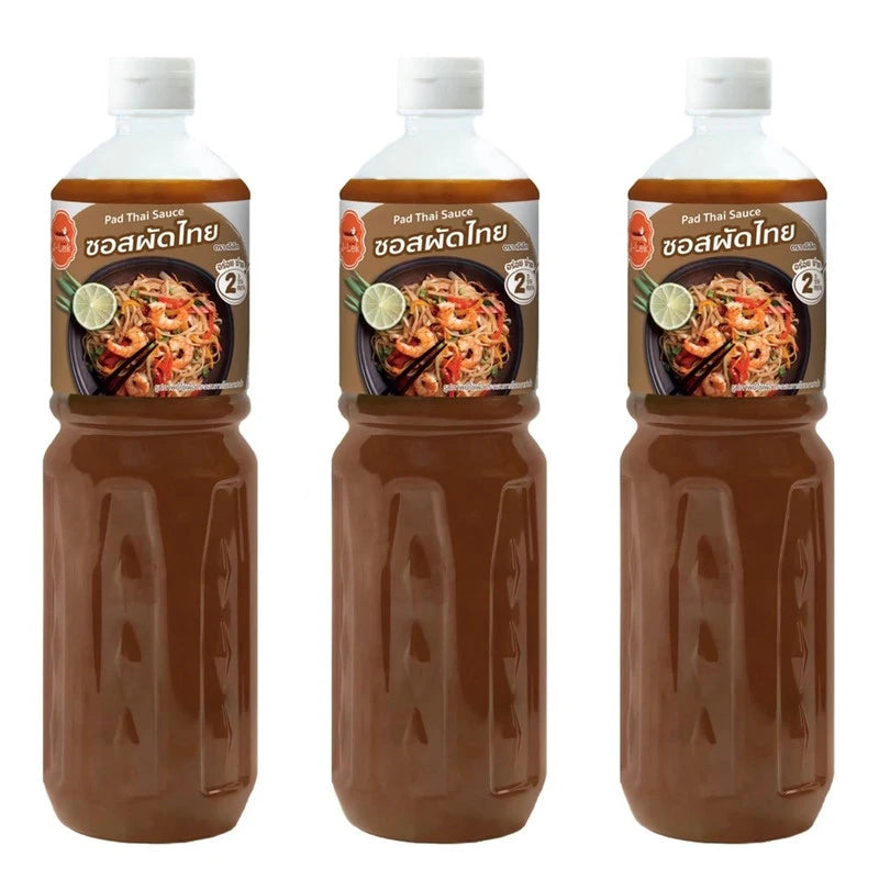 J-LEK Pad Thai Sauce in three 590g bottles, featuring dark soy sauce with a rich, flavorful Thai cooking sauce appearance