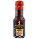 Jar of Maeboonlam fermented fish paste sauce with label visible, showing the traditional Thai condiment in a glass container.