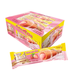 GRINNY strawberry coated snack filled with cream, 15g, showing the bright red, coated confectionery with creamy filling inside.
