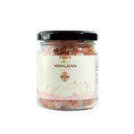 Zalt Himalayan Pink Salt in a clear container, showcasing its pink crystalline texture, certified dry grocery product.