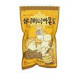Toms Honey Butter Almonds in a clear container, showing roasted almonds coated with sweet honey butter glaze, perfect for snacking.