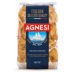 Agnesi Tagliatelle Mezzane fresh Italian pasta served on a plate with herbs and a fork in a grocery setting.