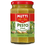 Jar of Mutti Green Tomato Pesto with fresh basil and green tomatoes, ready for pasta or spread in a grocery setting.