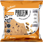 Justine's healthy peanut butter chocolate chip protein cookie on a white surface, showing the cookie's texture and chocolate chips.