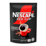 Nescafe Black Roast coffee drink in a glass with dark coffee and foam topping, showcasing its rich, bold flavor.