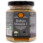 Close-up of Baboo Garam Masala spice jar, with colorful label and grains of aromatic Indian spice visible.