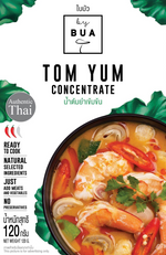 Bottle of By Bua Tom Yum Concentrate for flavorful Thai soup, with red and green chili peppers and herbs visible in the image.