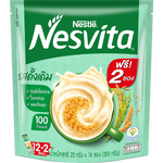Nesvita Instant Cereal Drink Original in a glass, showing a creamy, frothy cereal beverage with a spoon nearby.