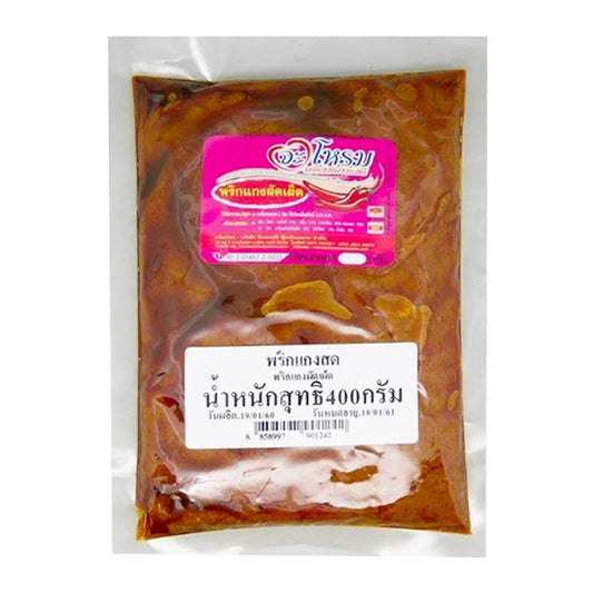 Jarome Spicy Fried Curry Paste 400g jar showing vibrant red and orange curry paste with fresh spices and herbs inside.