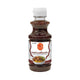 J-LEK Dry Noodle Sauce in a 235g plastic bottle, thick dark sauce with visible seasoning and herbs for flavorful noodles.