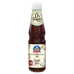 Deksomboon Keto Oyster Sauce bottle with label, placed on a kitchen countertop, highlighting the jar's golden sauce and branding.