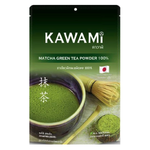 Kawami Matcha 100% drink in a clear glass, showcasing vibrant green matcha tea with frothy top and fresh tea leaves nearby.