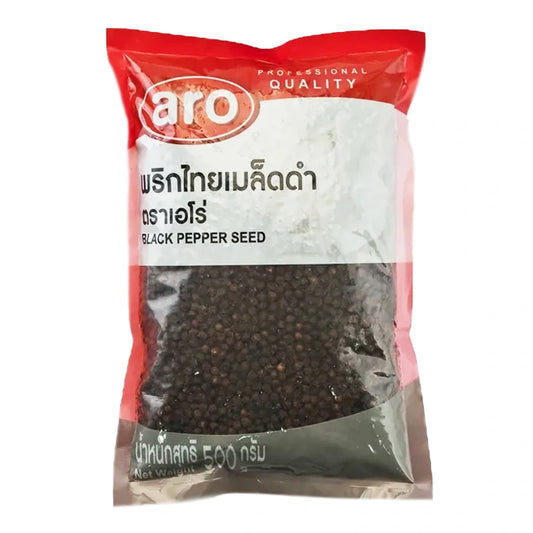 ARO Black Pepper 500g jar with black peppercorns spilling out, showcasing fresh, whole pepper for seasoning.