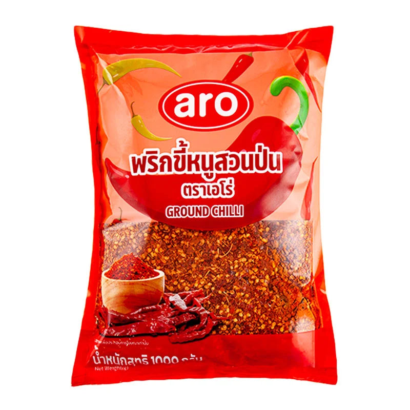 Ground chili spice in a 1 kg package from ARO, showcasing vibrant red chili powder in a clear bag.