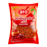 A 1kg pack of ARO Ground Chilli in a clear plastic bag, showing vibrant red dried ground chili powder for cooking.