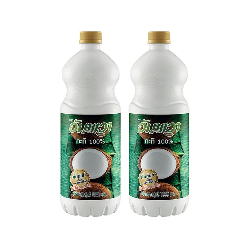 Two 1-liter PET bottles of AMPAWA Coconut Milk, creamy and fresh, with clear labeling on the packaging.