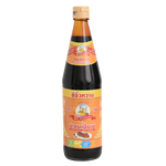 Bottle of Nguan Chiang Soy Sauce, a traditional grocery product with dark, savory liquid in a clear glass bottle.