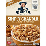 Quaker Simply Granola Honey & Almond flavor in a clear bowl, showing crunchy granola with honey and almond pieces.