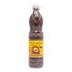 Bottle of PA-THONG Fermented Fish Sauce 750ml, clear glass container with dark liquid, label visible, on a kitchen surface.